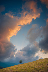 Obraz na płótnie Canvas Colorful clouds above the valley