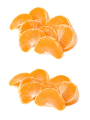 Pile of slice sections of tangerine isolated over the white background
