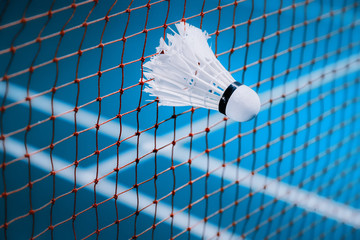 shuttlecocks struck on the net in badminton court for sport background - obrazy, fototapety, plakaty