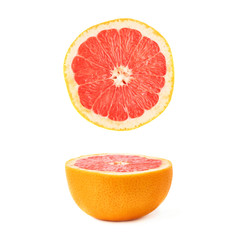 Single ripe grapefruit cut in half isolated over the white background