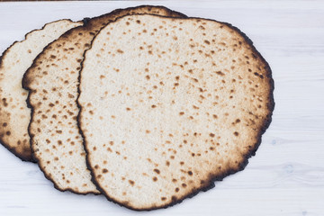 Matzot for passover celebration on a wooden table