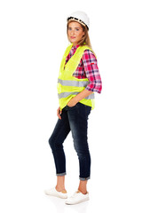 Fototapeta premium Young smile female builder in vest