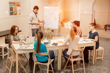 Young People listening Presentation of male Manager