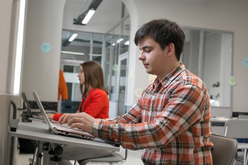 Obraz premium People working on Computers in open Space Office