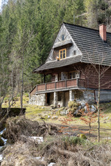 Fototapeta na wymiar Wooden huts in Chocholowska valley in spring, Tatra Mountains, Poland