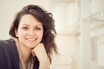 young smiling brunette woman in the kitchen