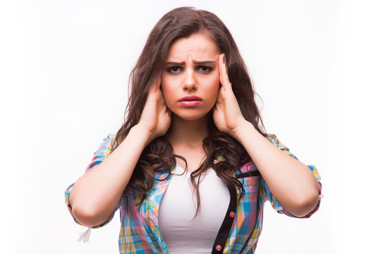 Young woman holding her head.Migraine and headache problem.Overworked,stressed woman.Menstrual and period pain.Intensive lifestyle and fast life.