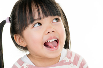 asian smiling little girl with pigtail isolated on white
