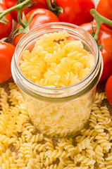 noodle in a storage glass and tomato