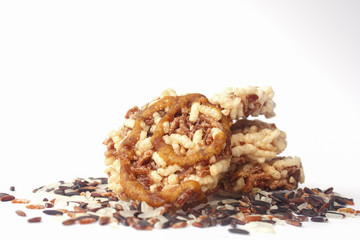 rice pop with rice, brown rice and dark violet rice isolated on white background