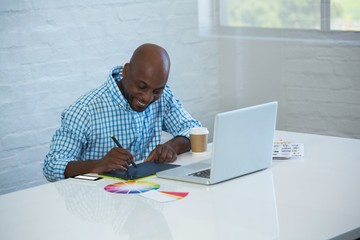 Graphic designer working on his graphics tablet 