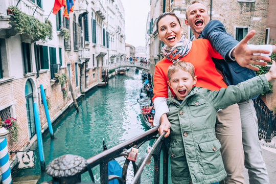 Madly happy family take a selfie photo on the one of bridge in V