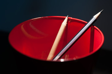 Pencils in a red bucket