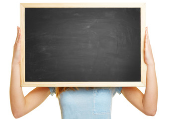 Woman holding empty blackboard