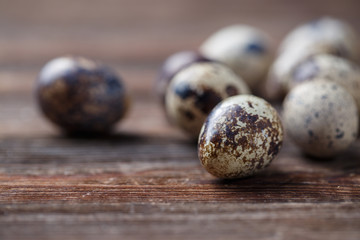 Group of quail eggs on thewooden background