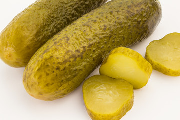 Close up of pickled cucumbers isolated on white