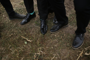 Black shoes on the ground in the wedding day