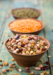 Raw legume on old rustic wooden table.