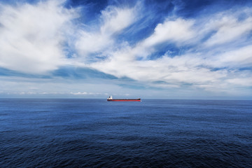 Cargo ship underway in the sea.