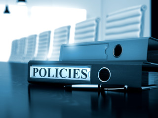 Policies. Business Concept on Blurred Background. Policies - Office Binder on Wooden Desk. Policies - Concept. 3D.