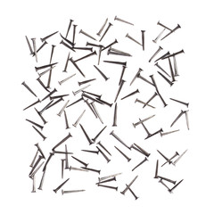 Scattered nails over surface isolated over white background