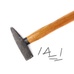 Big hammer with pile of nails over white isolated background