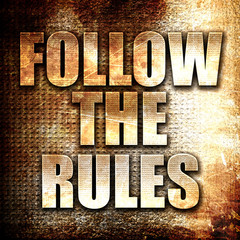 follow the rules, written on vintage metal texture