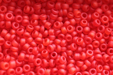 Beads of red colour close up macro photo