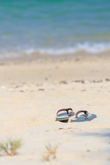 Lady sandal on the beach
