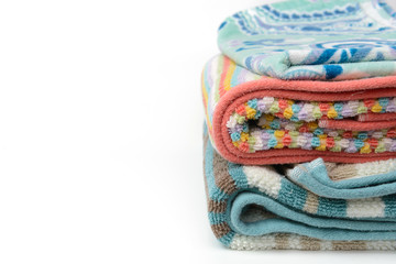 stack of colorful towel, white background