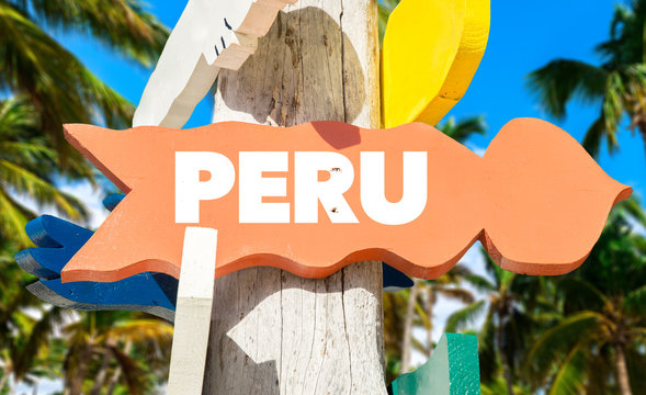 Peru signpost with palm trees