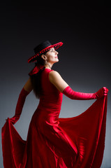 Woman dancing dances in red dress