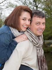 Cheerful and  happy couple hugging and laughing.