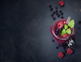 Berry smoothie on rustic background