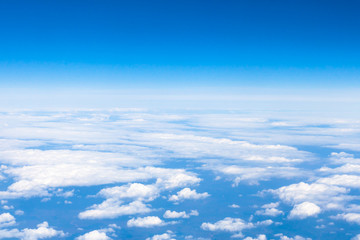 Fototapeta na wymiar above view clouds and earth horizon from aircraft