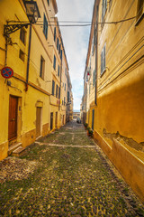 Fototapeta na wymiar narrow street by the sea in Alghero