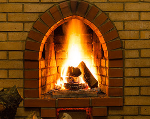 spurts of fire in brick fireplace