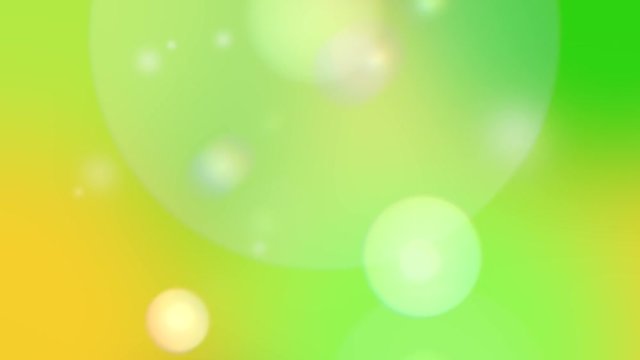 Random moving bokeh shapes over yellow and green background