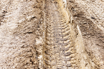 deep ruts in loamy soil of country road