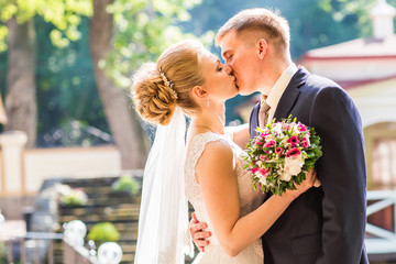 Kiss the bride and groom
