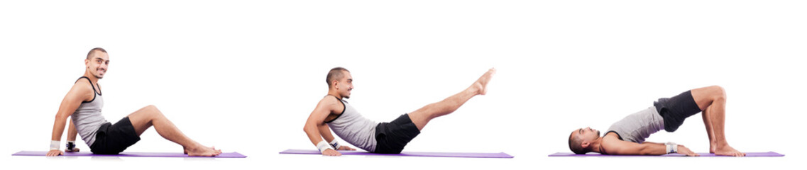 Obraz premium Man doing exercises on white