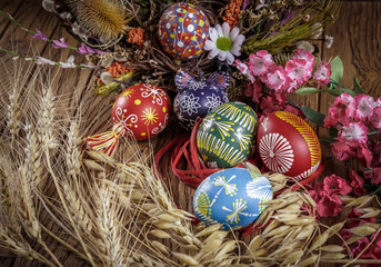 Fototapeta na wymiar Easter decoration. colored Easter eggs and composition of dried
