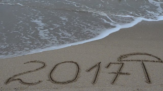 2017 in the form of an inscription on sand, the beach.