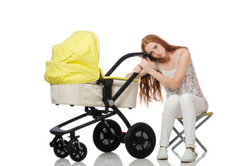 Woman with baby and pram isolated on white