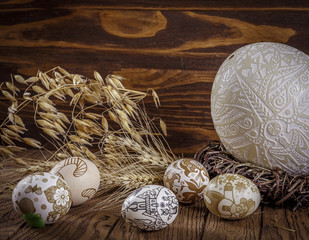  Handmade Easter eggs and ears of corn, on a wood background. Ex