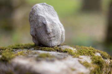 Part of a tombstone statue in cemetery