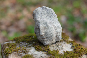 Part of a tombstone statue in cemetery