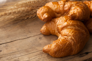 Tasty croissant still life rustic wooden background