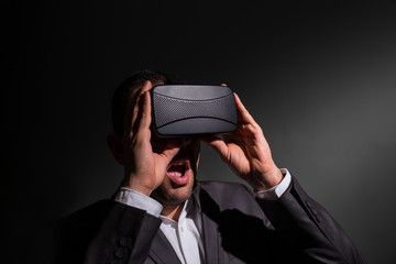 Businessman wearing virtual reality goggles