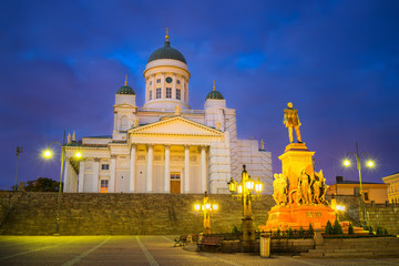 Fototapeta na wymiar Cathedral and monument to Russian Emperor Alexander II in the Old Town of Helsinki, Finland